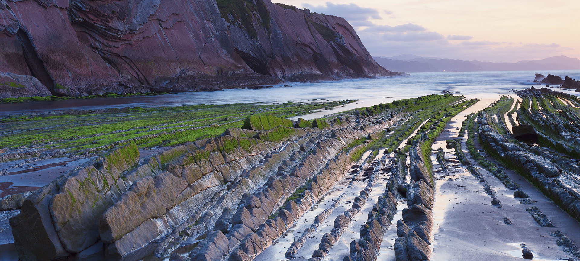 View of the Zumaia flysch (Gipuzkoa, the Basque Country) on Itzurun Beach View of the Zumaia flysch (Gipuzkoa, the Basque Country) on Itzurun Beach